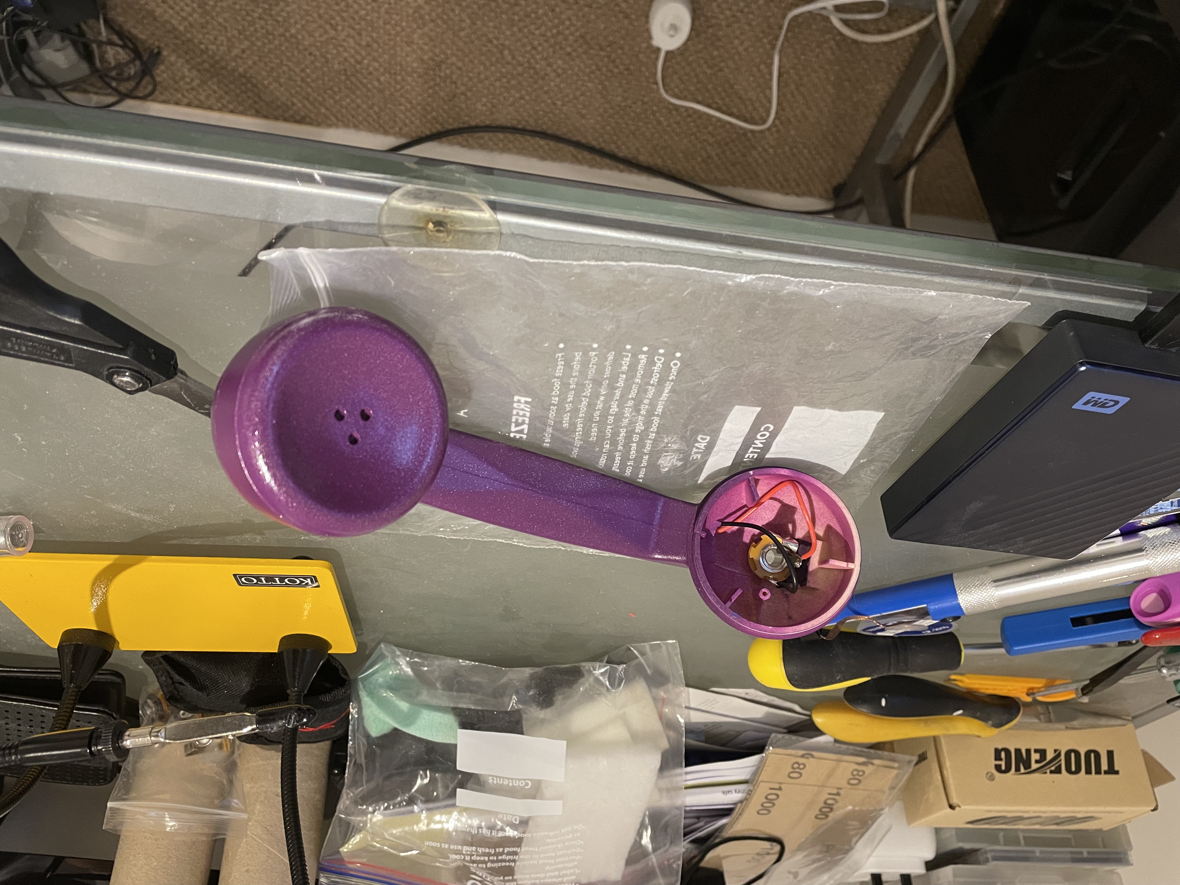 upcycled rotary handset in magenta with exposed wiring